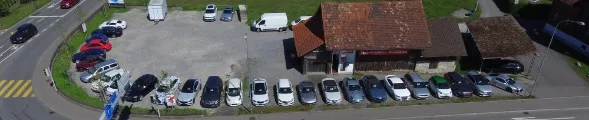 Overhead view of the dealership lot and surrounding road, showing its accessible location.