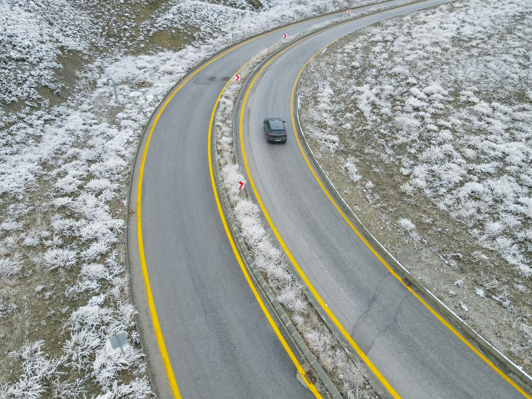 car driving snow curve